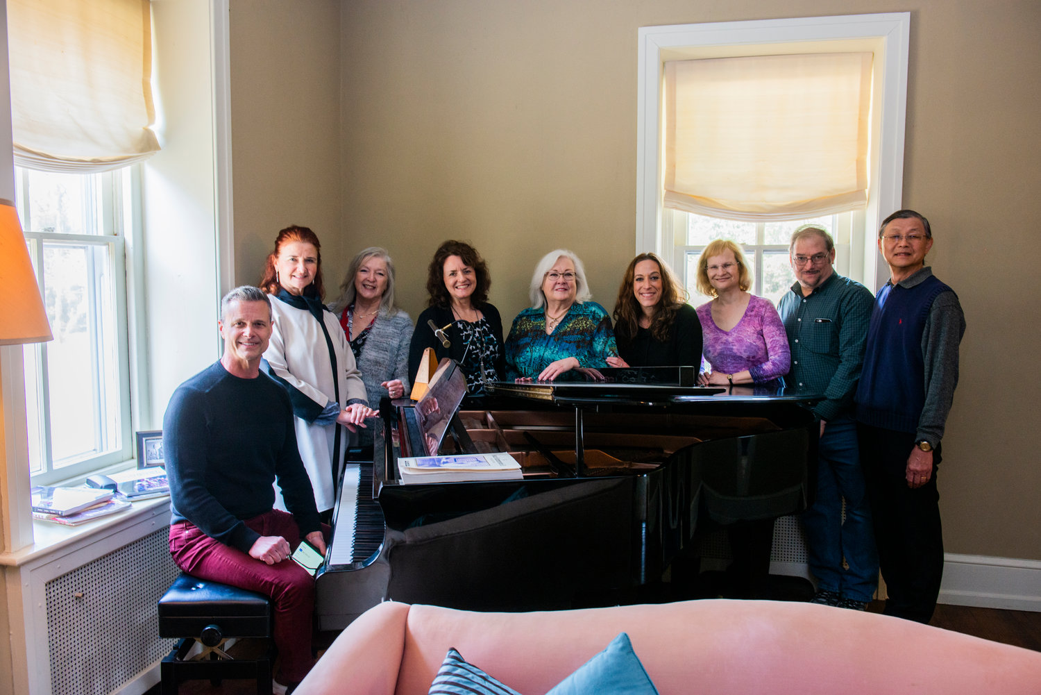 Members of the Philly Pops gather around the grand piano at Highland Farm.