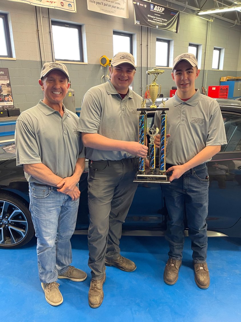 Hunterdon County Polytech automotive technology students Ethan Walker, middle, and Christopher Colasurdo, right, earned first place in the GLVADA Auto-Tech Competition. The team was led by Polytech’s automotive technology instructor, Christopher Scheuerman, left.