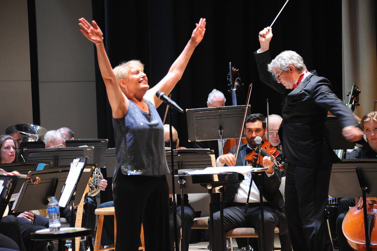 Liz Callaway finishes her song as Conductor Gary Fagin signals the end to her rendition of Stephen Sondheim’s “Send in the Clowns” at Fagin’s final Pops Concert with the Bucks County Symphony Orchestra last weekend at Delaware Valley University.