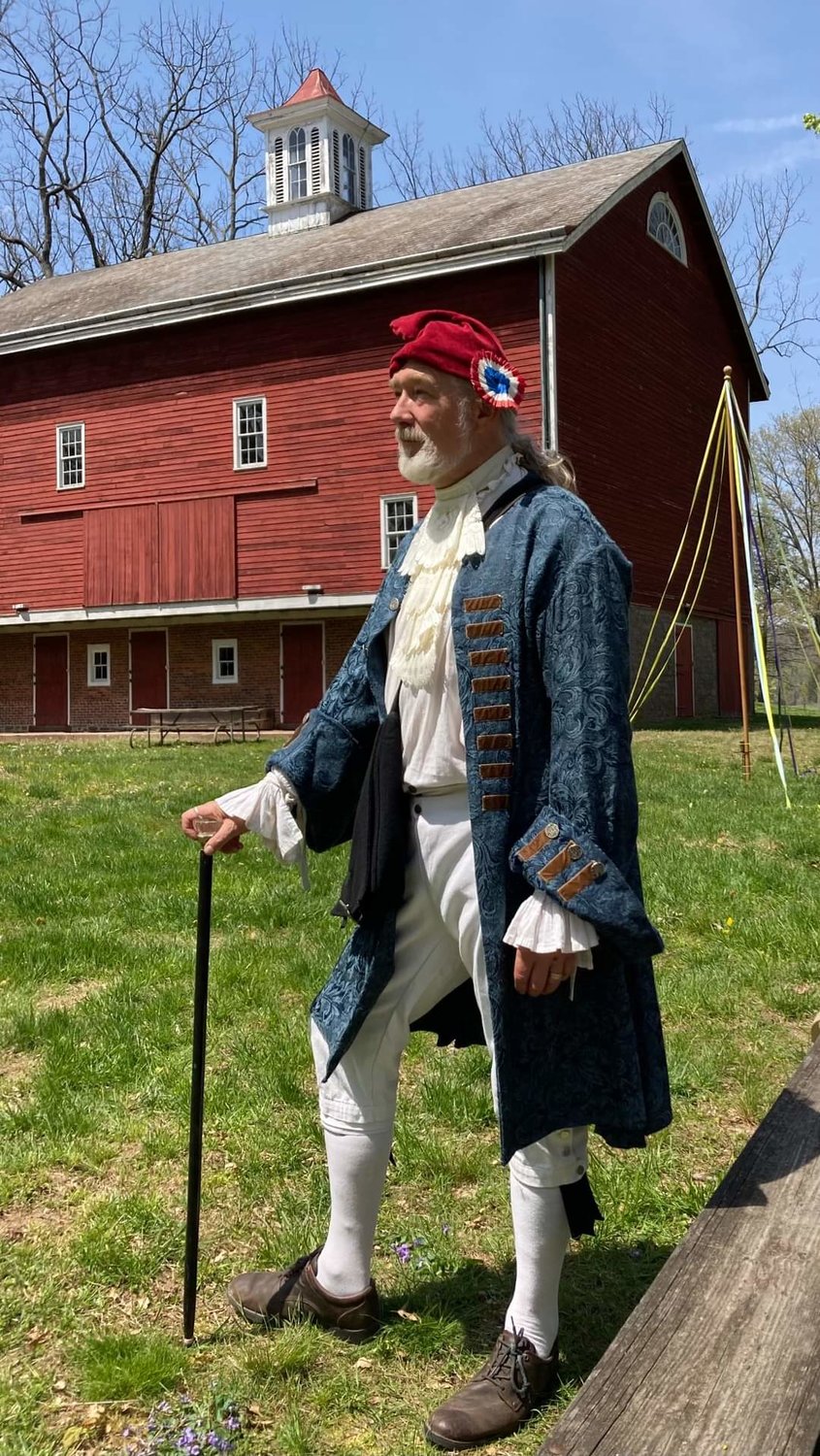 Reenactor Douglas Milne shows off his liberty cap. Caps like these were hoisted up atop the May Pole on May Day in the American Colonies a symbol of protest against the British during the Revolution.