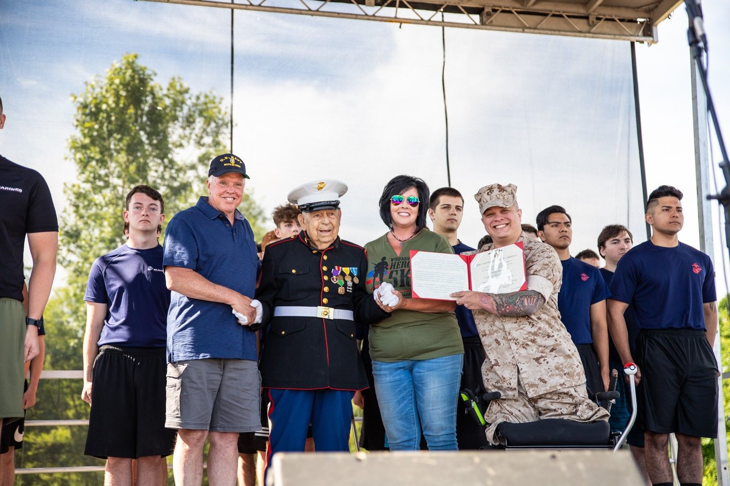 At the 2019 Wounded Hero 5K, WWII and Korean War Veteran Sgt. Sam Bonanno, United States Marine Corps, is awarded his Purple Heart one year before he passed away. Also in uniform is Cpl. Tyler Southern, Afghanistan Veteran Wounded Warrior.