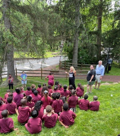 Jodi Specter, president of American Bulldog Rescue, speaks to second graders.