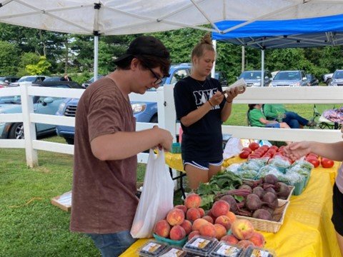 Jared Sommer and Mary Laurensen of Charlann Farm sell produce at the Lower Makefield Farmers' Market.