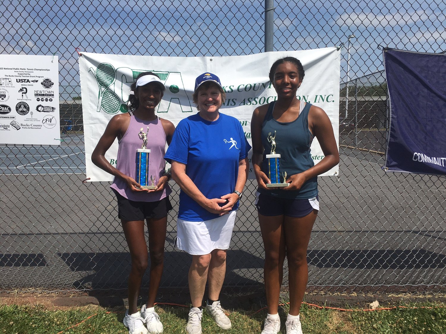 From left are: Girls 18 champion Nilaa Ponnappan, Laura Canfield, tournament director and USTA vice president, and finalist Laurie Fleming.