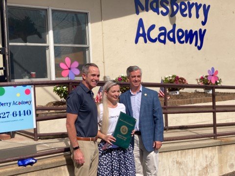 KidsBerry Academy owner Anastasia Plotnikova with state Sen. Steve Santarsiero, left, and Bucks County Commissioners Chairman Bob Harvie at the grand opening of the new day care in Yardley Borough.