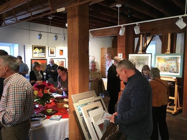 Art fans look over the works for sale at Stover Mill Gallery in Erwinna.