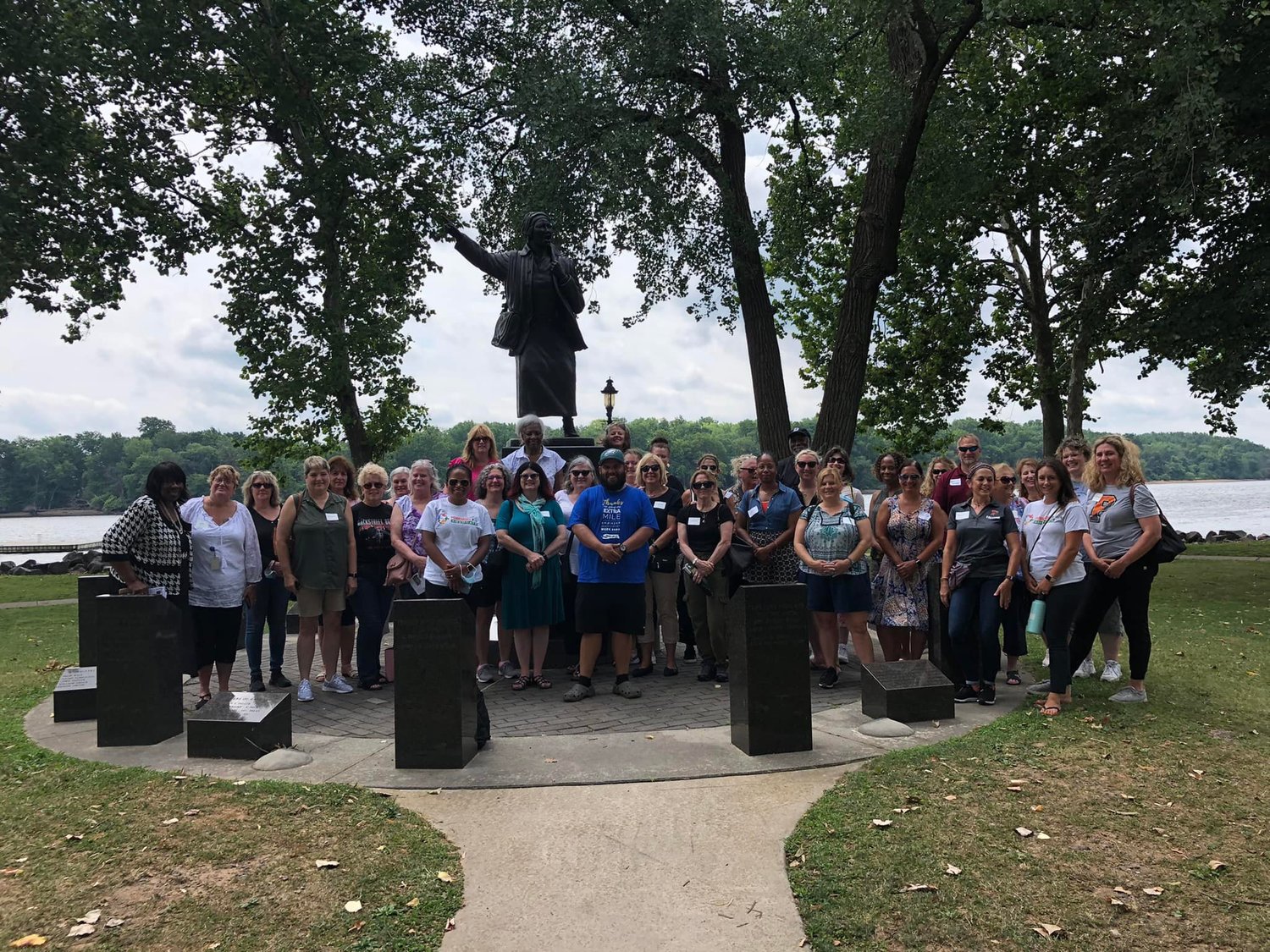 A group of Pennsbury administrators and teachers at the statue of Harriet Tubman on the Bristol waterfront.