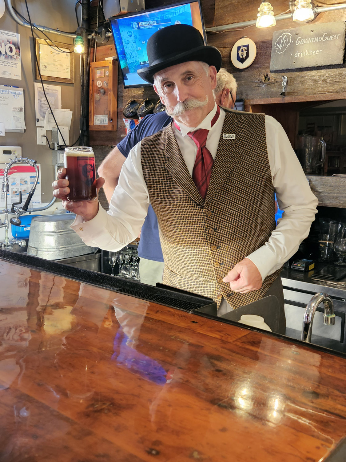 Henry Chapman Mercer (aka Jamie Bradley) offers a glass
of Mercer Plus Ultra Historic Ale made from his personal recipe at Geronimo Brewing in Doylestown.