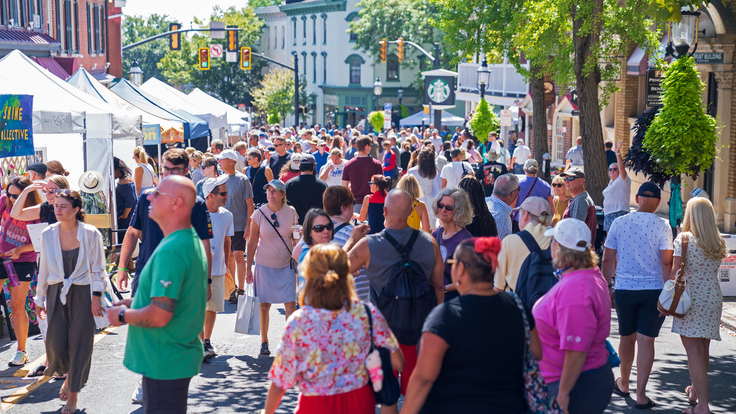The Doylestown Arts Festival drew upwards of 20,000 people on Saturday, and several thousand made their way out on Sunday in spite of the rain.