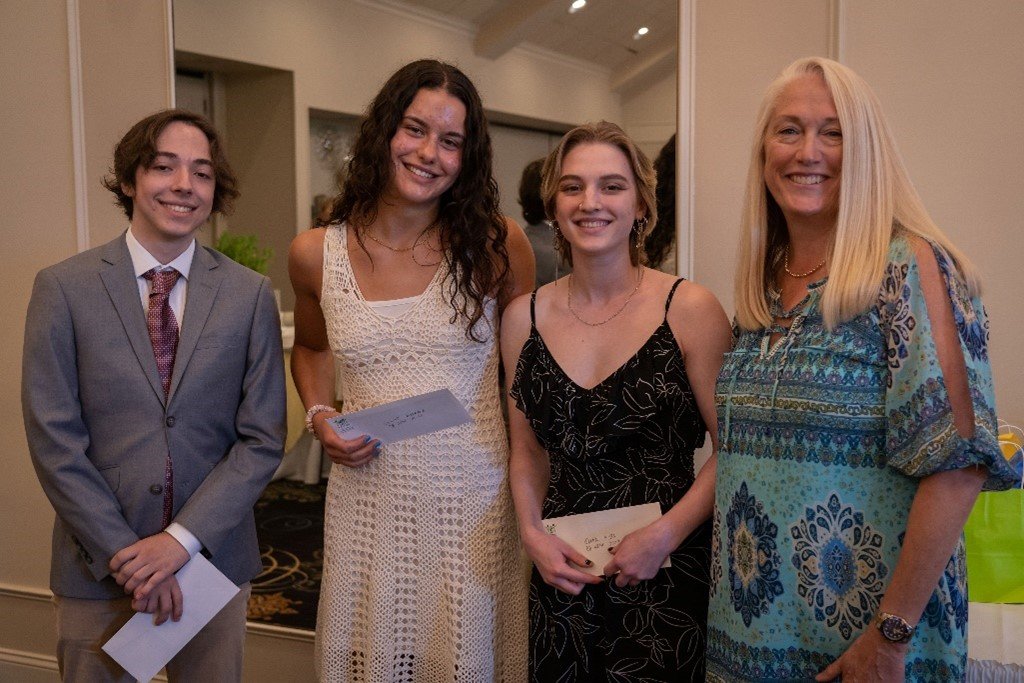CB West Boomerang Scholarship recipients Owen Quimby, Justine Maraska and Skyler Koba with Kimberly Cambra.