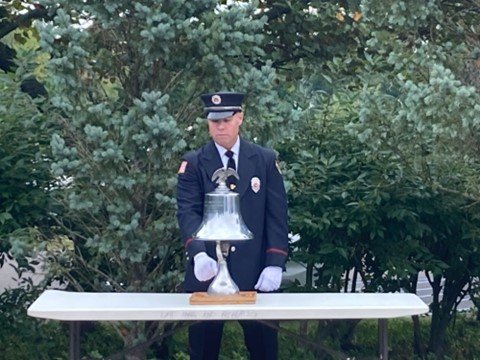 Yardley-Makefield Fire Company member Jimmy Egan rings a bell marking the significant moments of Sept. 11, 2001 during a remembrance ceremony at the Garden of Reflection in Lower Makefield Township.