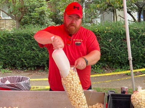 James Armillei of Best Darn Kettlecorn bags up the product
during the Harvest Day Festival in Yardley Borough.