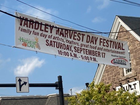 A banner hangs above Main Street in Yardley Borough during the Harvest Day Festival.