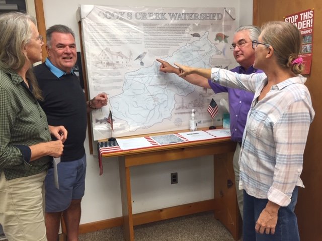Scott Douglass (right) and Rebecca Hayden point out some special features on the new Cooks Creek Watershed map they presented to Durham Township. Looking on are Lois Oleksa and David Juall, chairman of The Durham Township Environmental Advisory Council.
