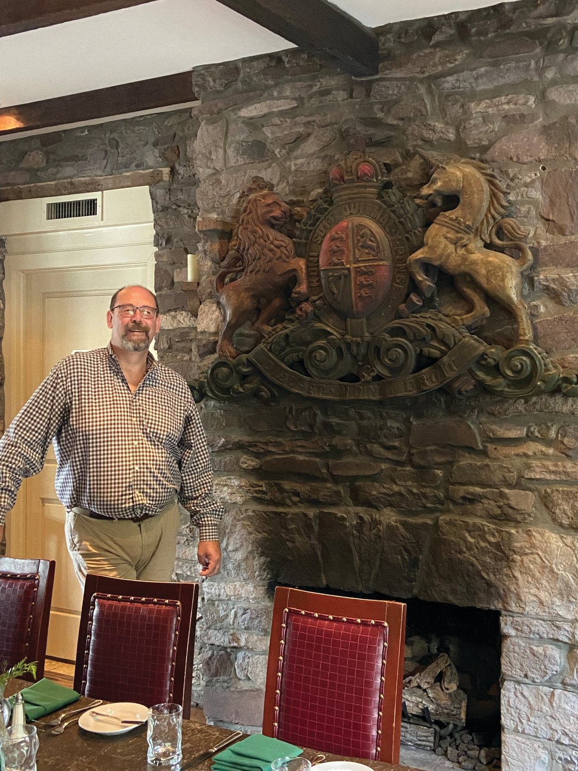 The British royal coat of arms at the Black Bass Hotel, holds special meaning for Grant Ross, general manager of the Black Bass Inn.