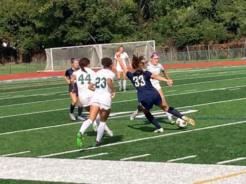Council Rock North’s Mia Cairone (No. 33) tries to maneuver through Pennridge’s Caitlyn Peace (No. 23), Casey Malone (No. 44) and others during Pennridge’s 2-1 win.