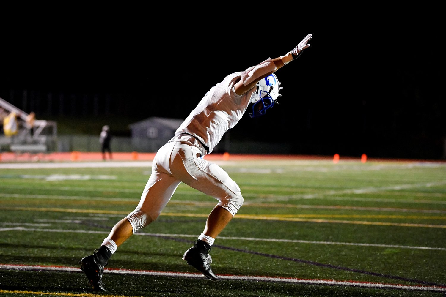 Quakertown’s John Eatherton celebrates after his second TD with a 1-yard plunge in the third quarter