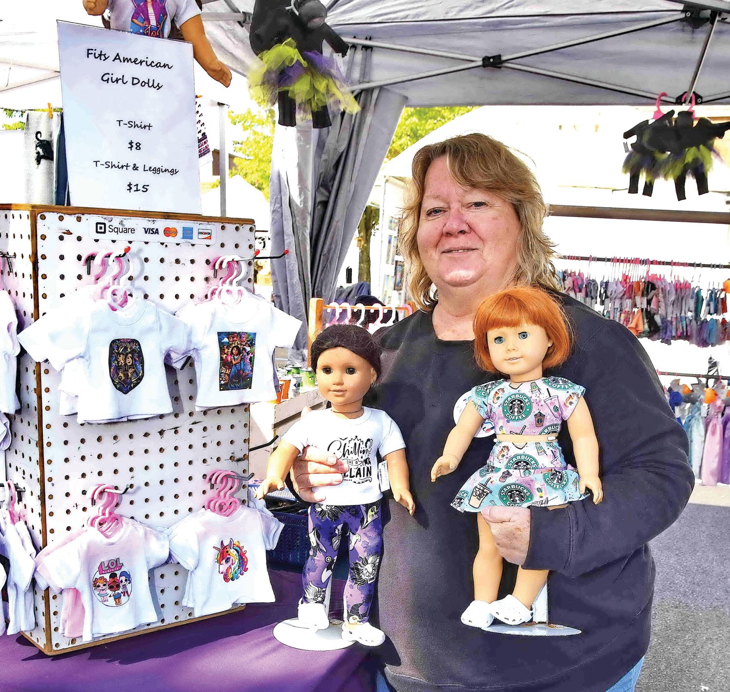 Jane Davis with her handmade clothes for dolls.