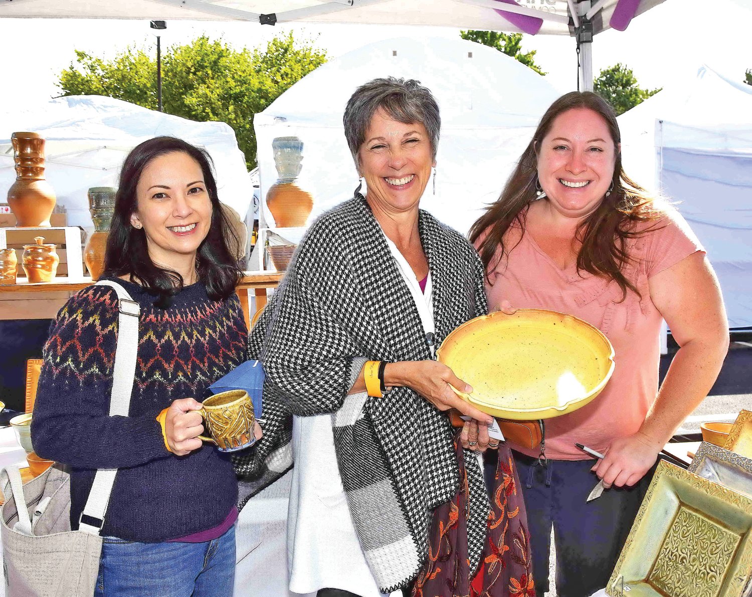Visitors Elissa Vine and Lorrie Rogers with potter Jessica Greet and her Fairydust Pottery.