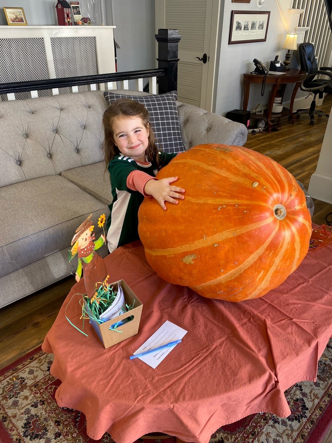 Guess the weight of the Giant Pumpkin located at Class-Harlan Real Estate.