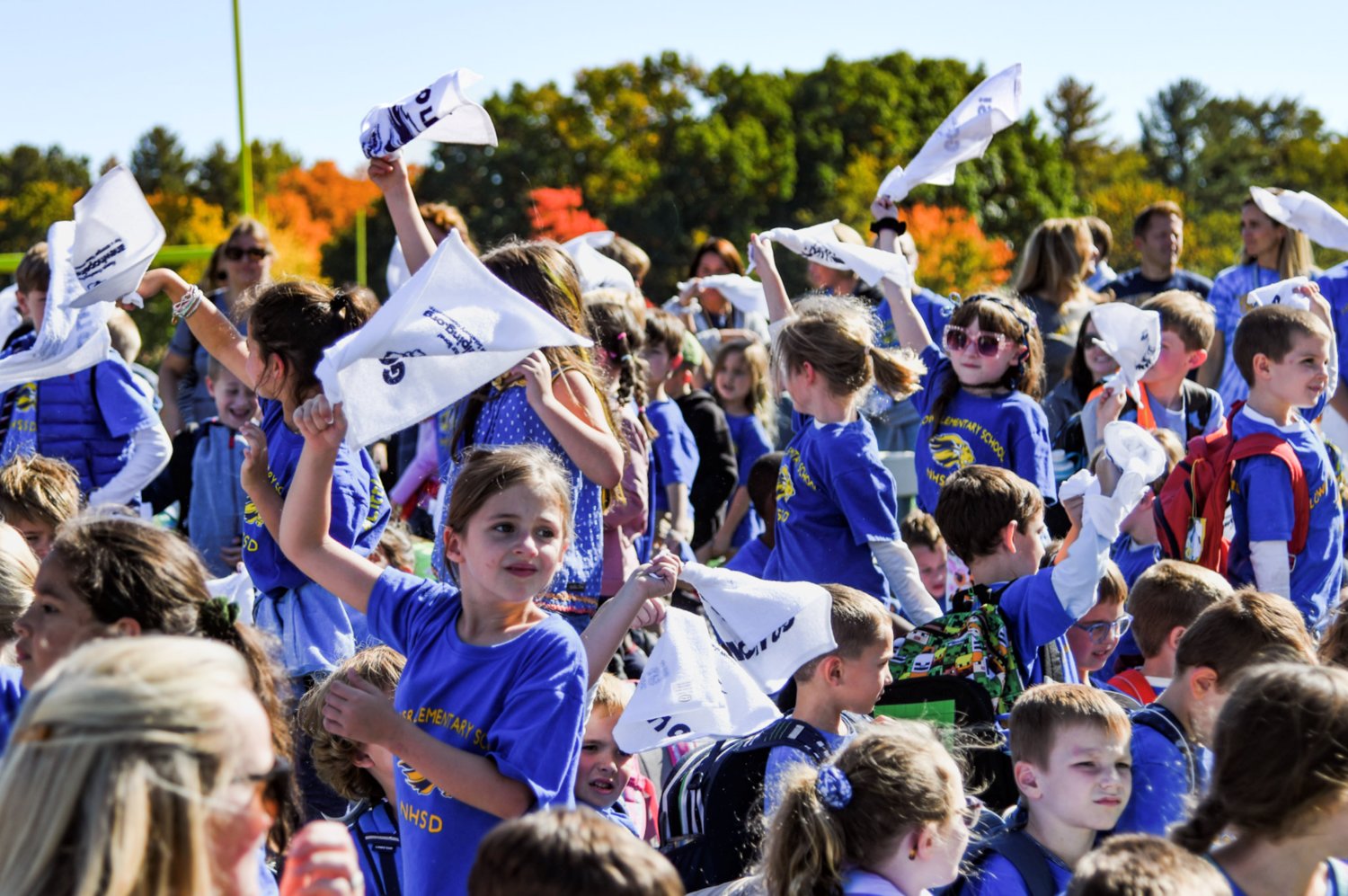 New Hope-Solebury students wave rally towels at the first-ever districtwide pep rally, which welcomed all 1,300 students from kindergarten through 12th grade to join together on its brand-new turf field Oct. 14.