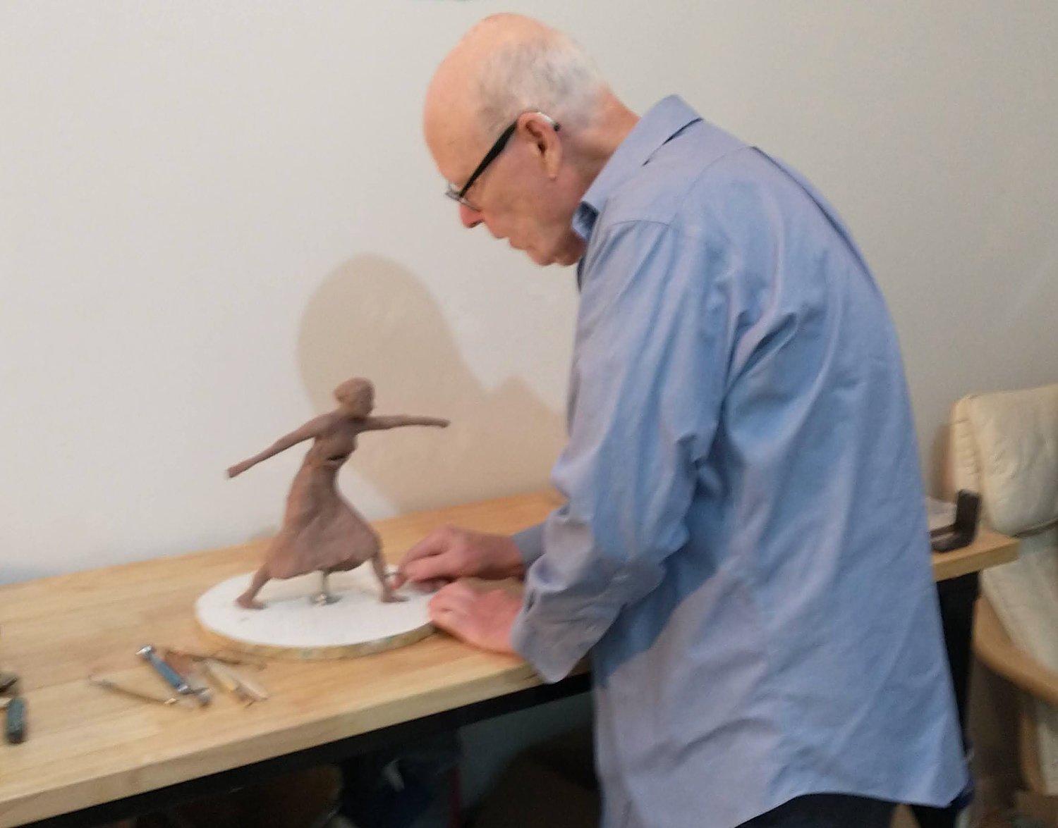 Desmond McRory is at work sculpting “Democracy Sounds
the Alarm.”