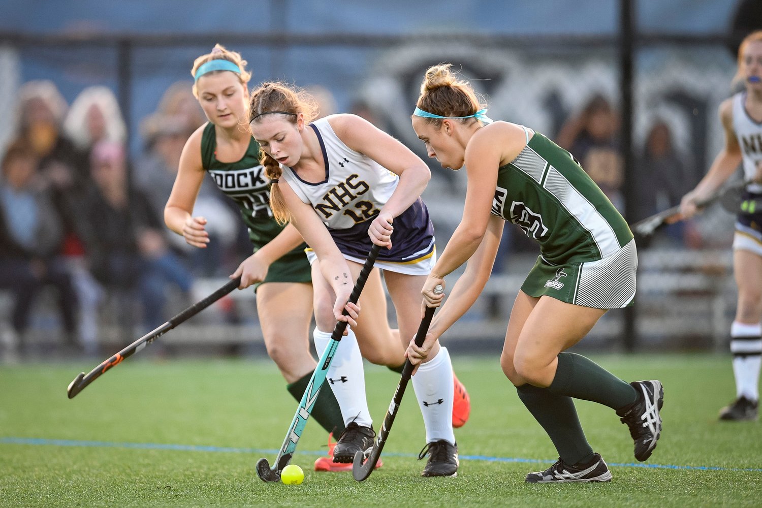 New Hope-Solebury’s Rylee Logston gets off a pass between two Dock defenders.