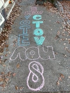 A crew of 18 Chalk Ninjas decorated town sidewalks with reminders to vote before or on Election Day, Tuesday, November 8.