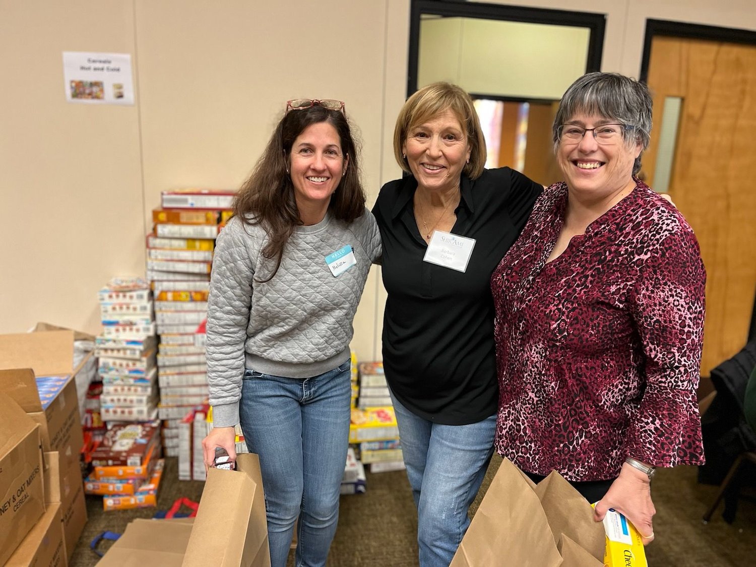 More than 200 volunteers lent a hand at the food sorting and packing event held at Shir Ami Reform Synagogue of Newtown last month. From left are Melissa Riskin of Newtown; Barbara Cohen of Fort Washington; and Donna Desantis of Langhorne.