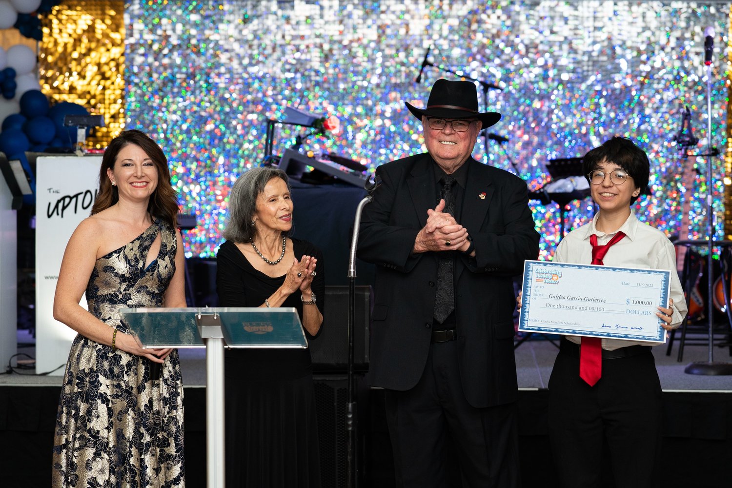 From left, Executive Director Christina McGinley, Gladys Mendieta White, Bob White and award recipient Galilea Garcia-Gutierrez.