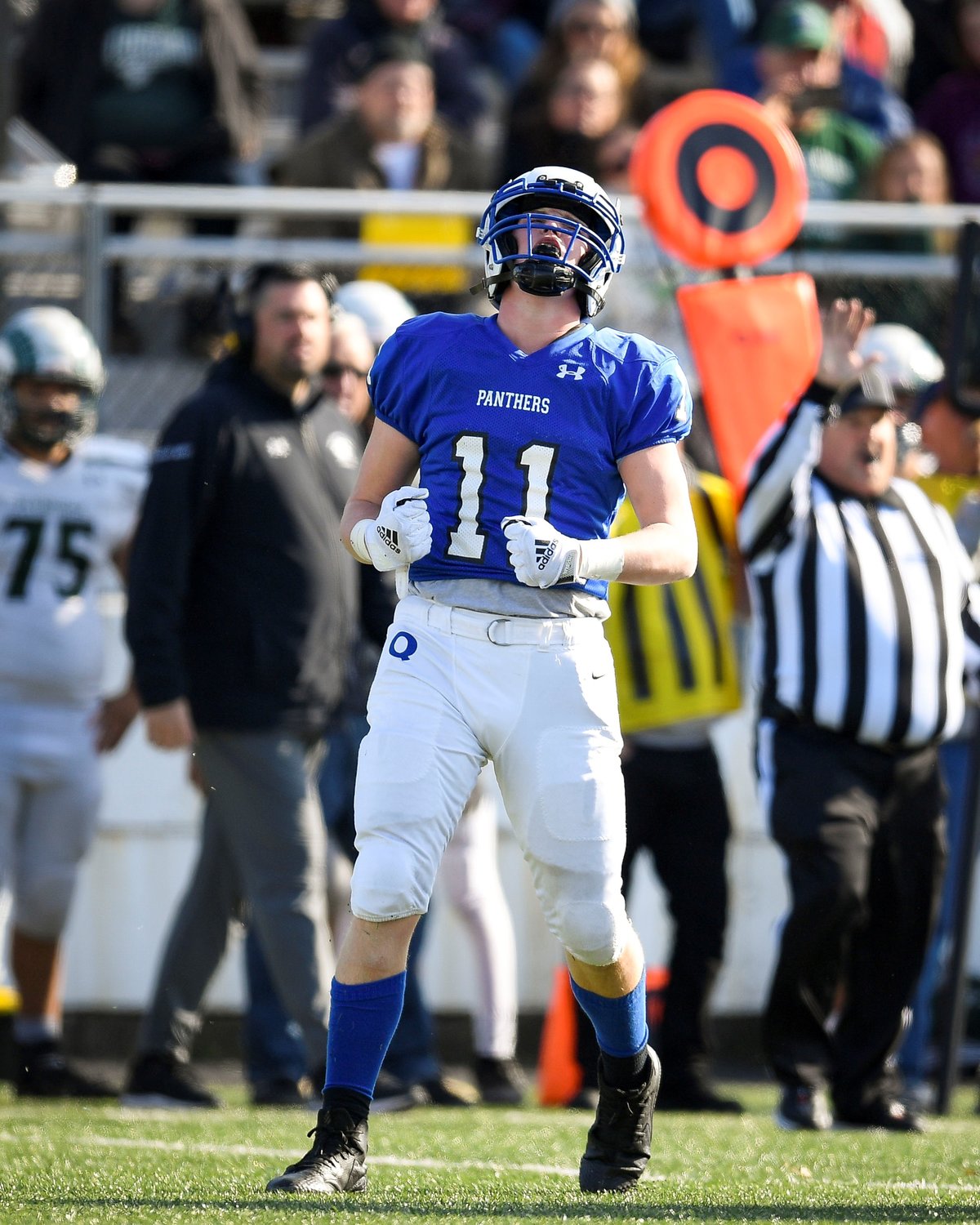 Quakertown’s Anthony Ferrugio is hyped up after a big defensive play late in the fourth quarter.