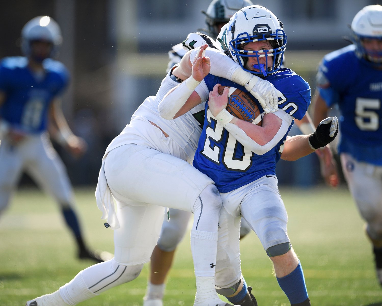 Quakertown’s Gavin Carroll cuts upfield during the third quarter and is tackled by Pennridge’s Hunter Burdick.