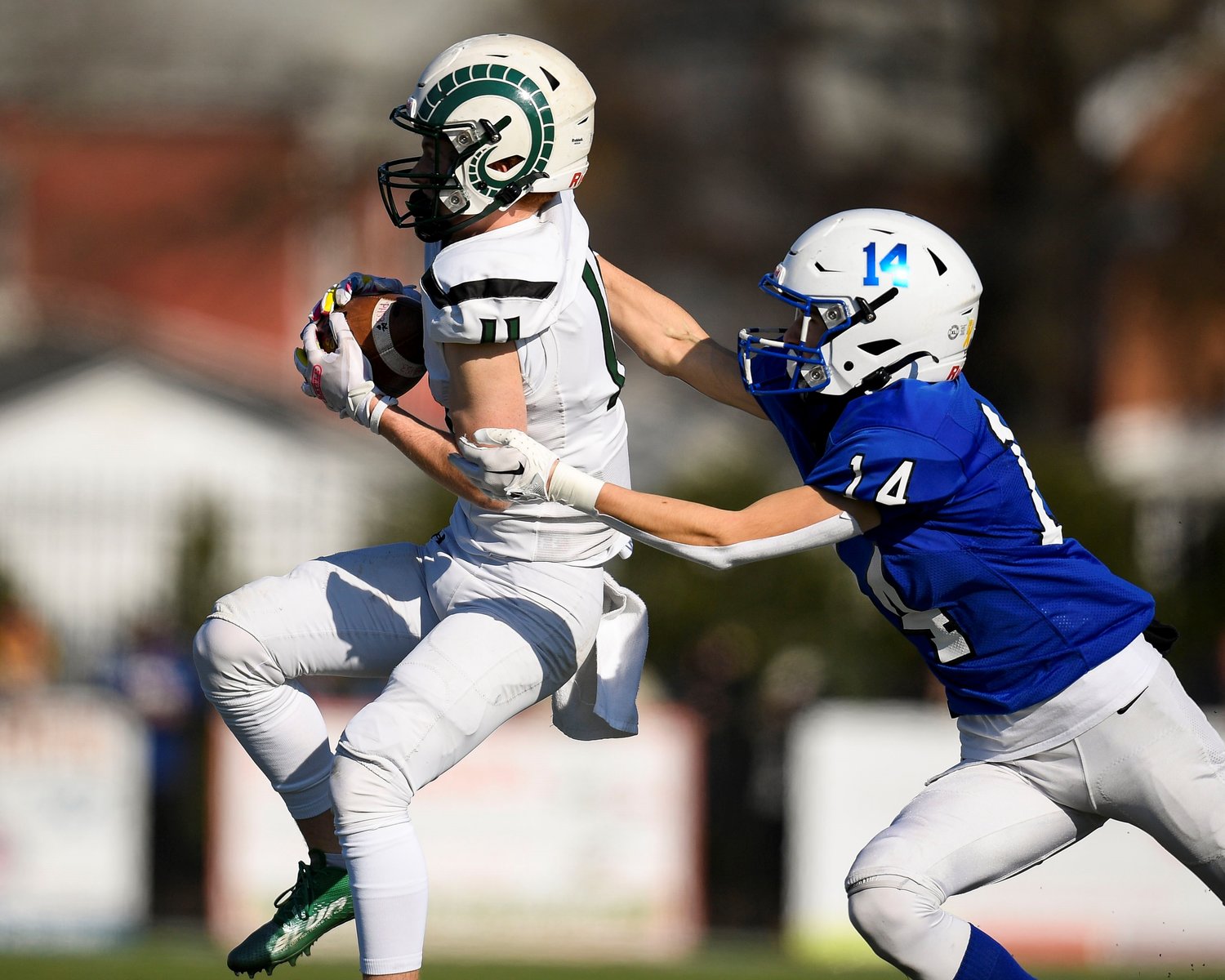 Pennridge receiver Nick Swanson steps in front of Quakertown’s Reagan Payne for one of quarterback Noah Keating’s 14 completions.
