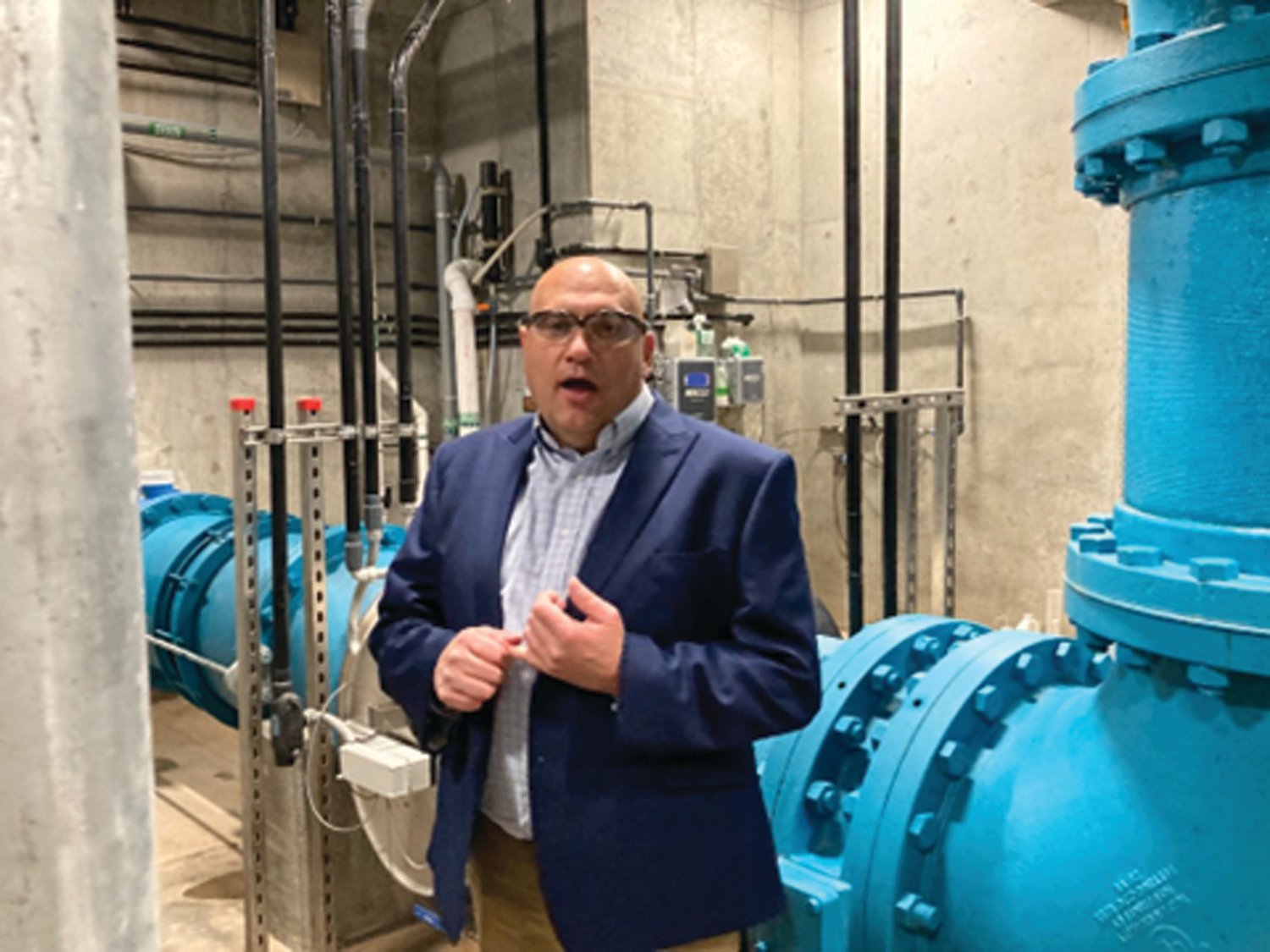 Pennsylvania American Water official Jim Gable shows off a new ultraviolet light disinfection system that is part of $24 million in upgrades at the company’s Lower Makefield Township treatment plant.