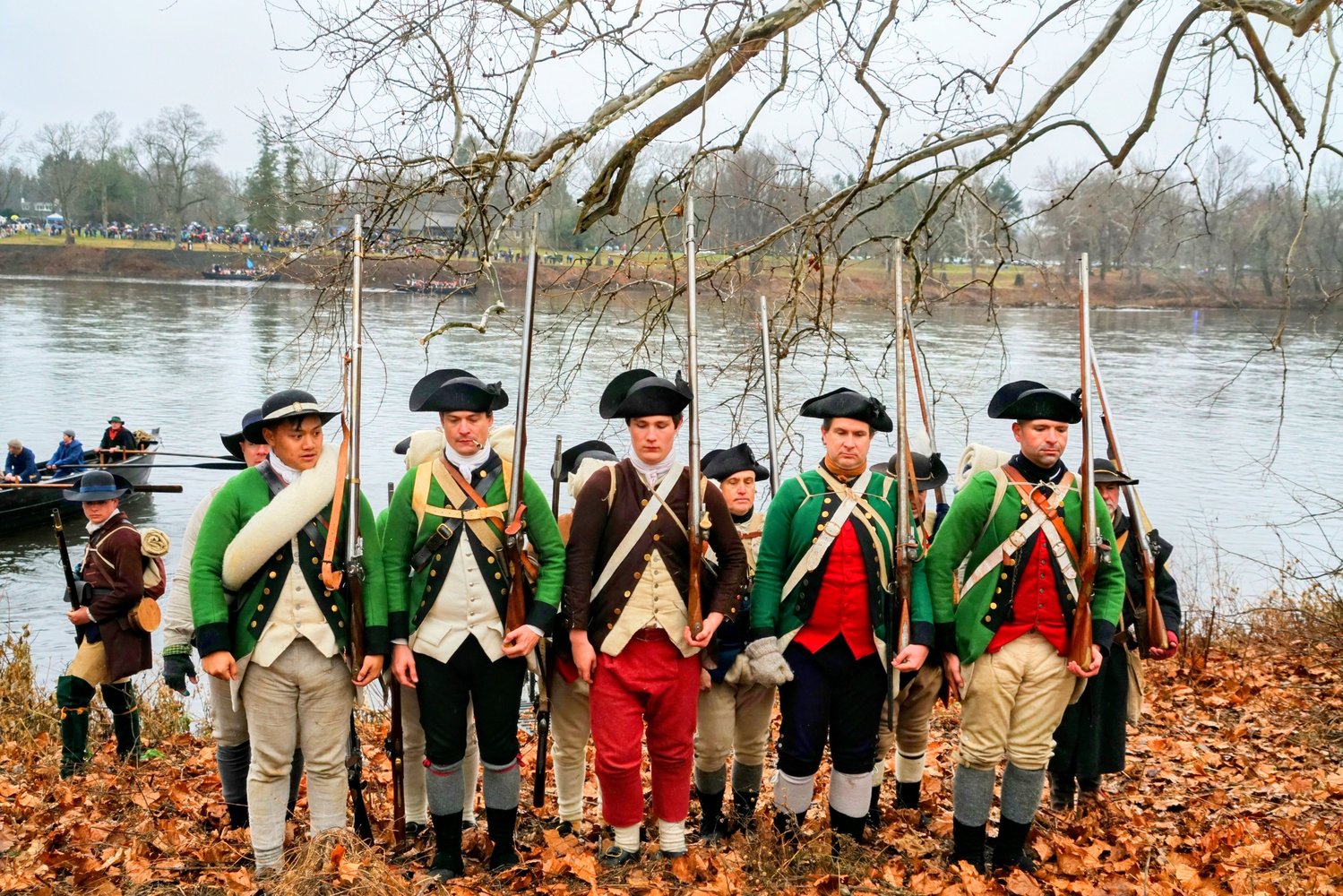 Reenactors stand at attention.