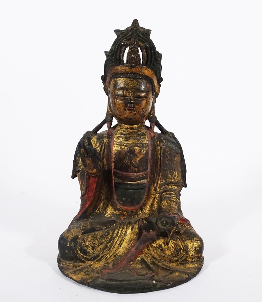 A Chinese Ming Dynasty parcelgilt and polychrome-painted bronzefigure of seated Buddha wearingcrown, has an estimated price of$2,000-$4,000.