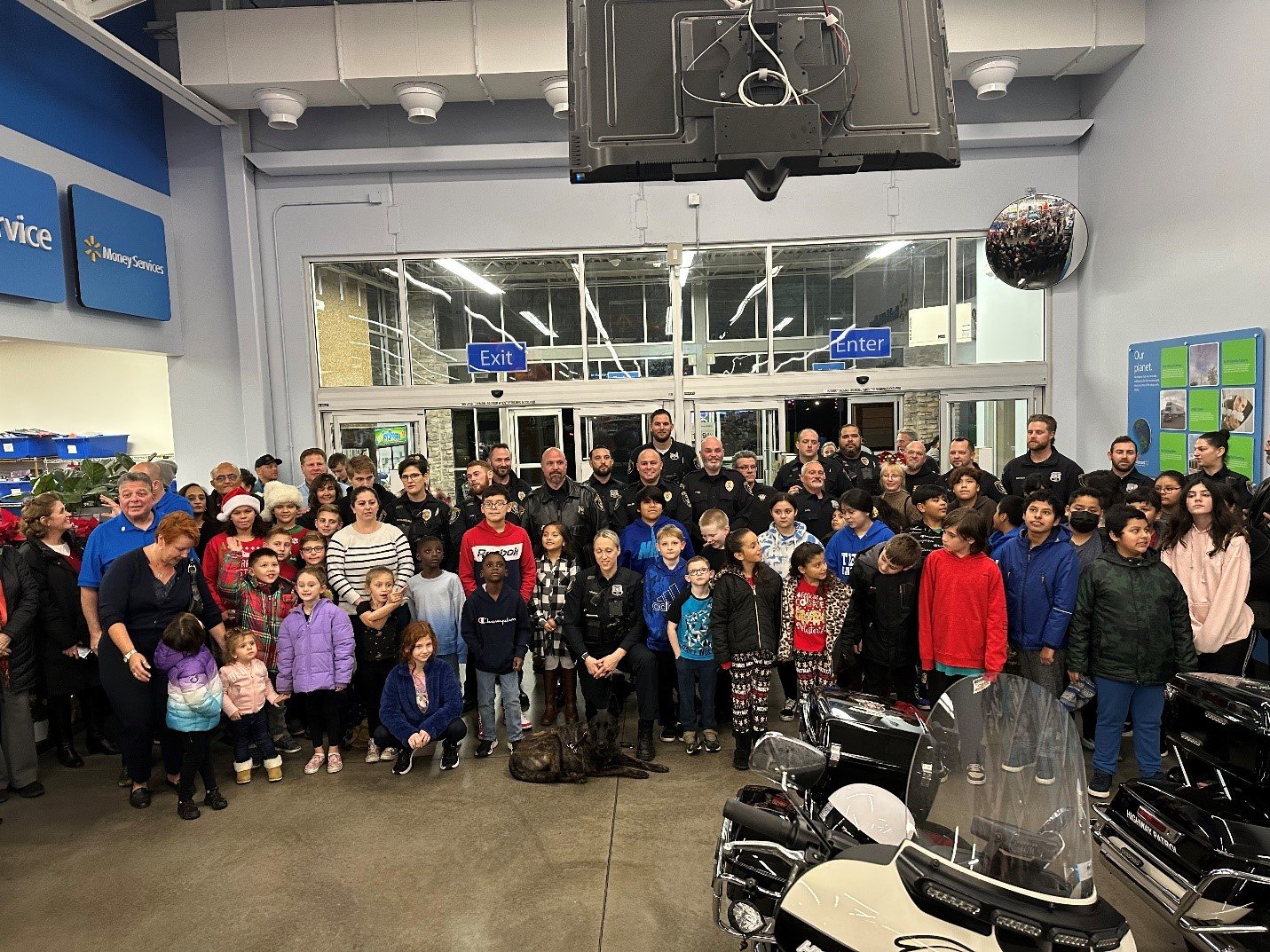 During the Warrington Township Police Department’s fifth annual “Shop with a Cop” event at the Warrington Walmart, 22 officers shop with 35 elementary school students who live in Warrington.