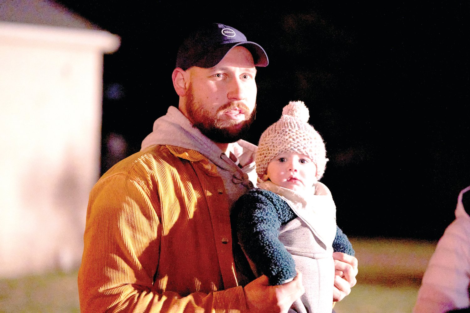 Greg Pinelli and his 8-month-old son Jack listen to the music at Bristol’s Mill Street Fire & Ice Festival Friday, Jan. 20, 2023, in Bristol Borough.