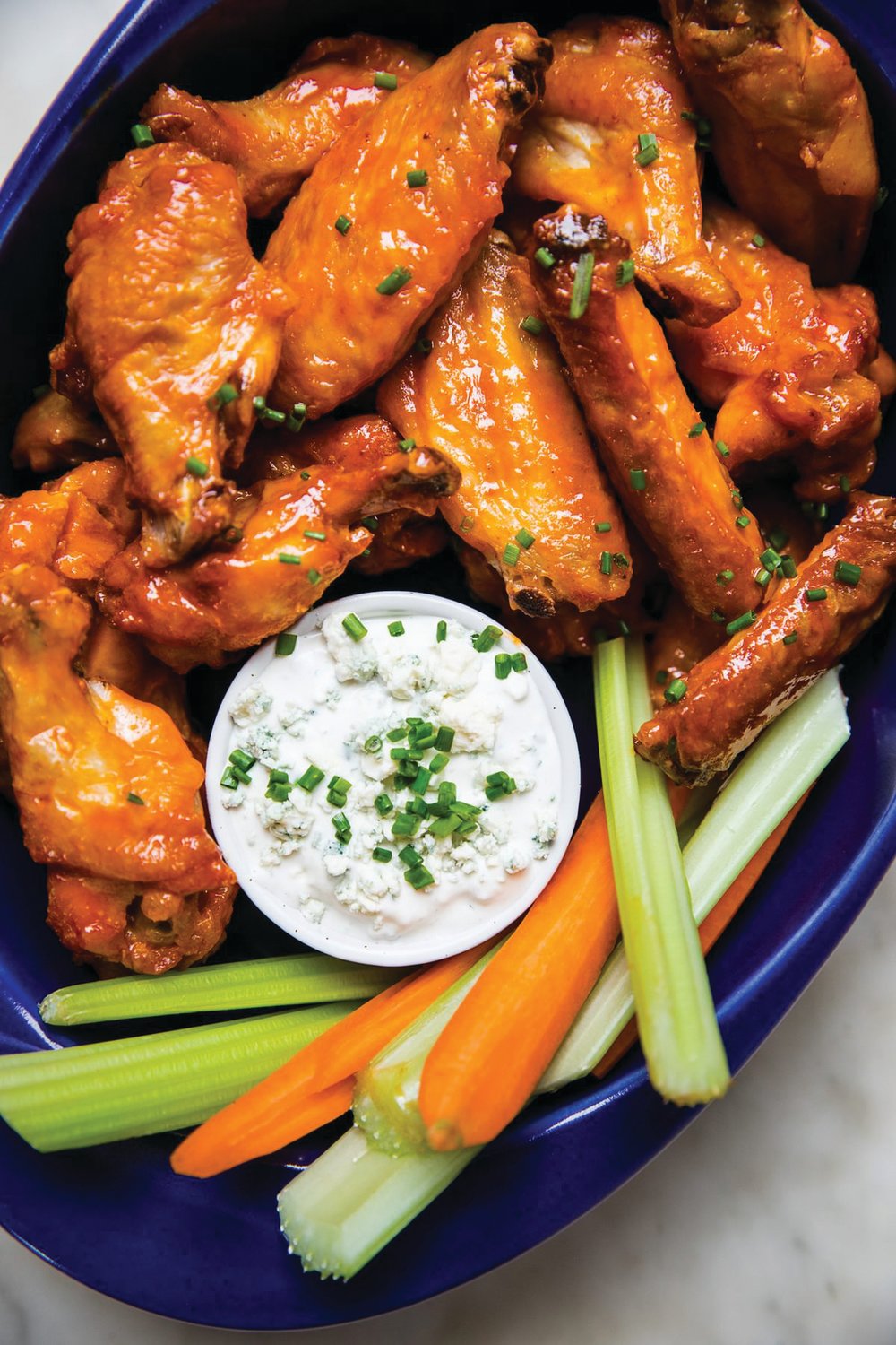 Themodernproper.com
Blue cheese or ranch dressings are good accompaniments for chicken wings, which are believed to be the most popular food served on Super Bowl Sunday.