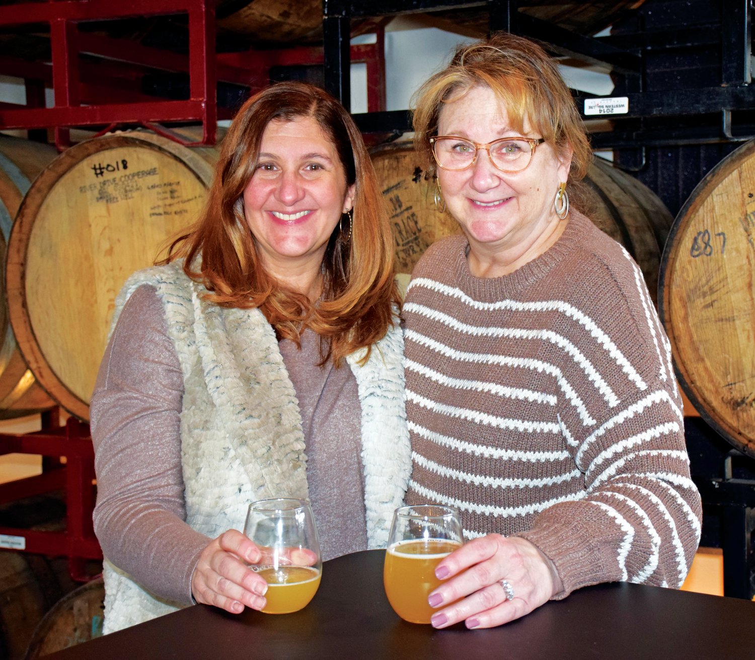 Sisters-in-law Nicole and Lisa Schilling at enjoy drinks at Free Will Brewing Co. on East Walnut Street during the 'Winter Wanderland' celebration in downtown Perkasie on Jan. 28.