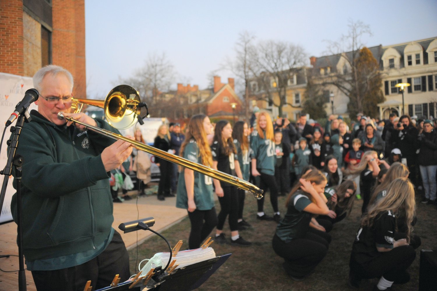 The Galena Brass Band belts out tunes to keep the crowd entertained as members of the Fitzpatrick Irish Dancers prepare for their performance Friday evening at the Herald’s “Bucks County Loves the Birds” pep rally on the lawn of the old county courthouse in Doylestown.