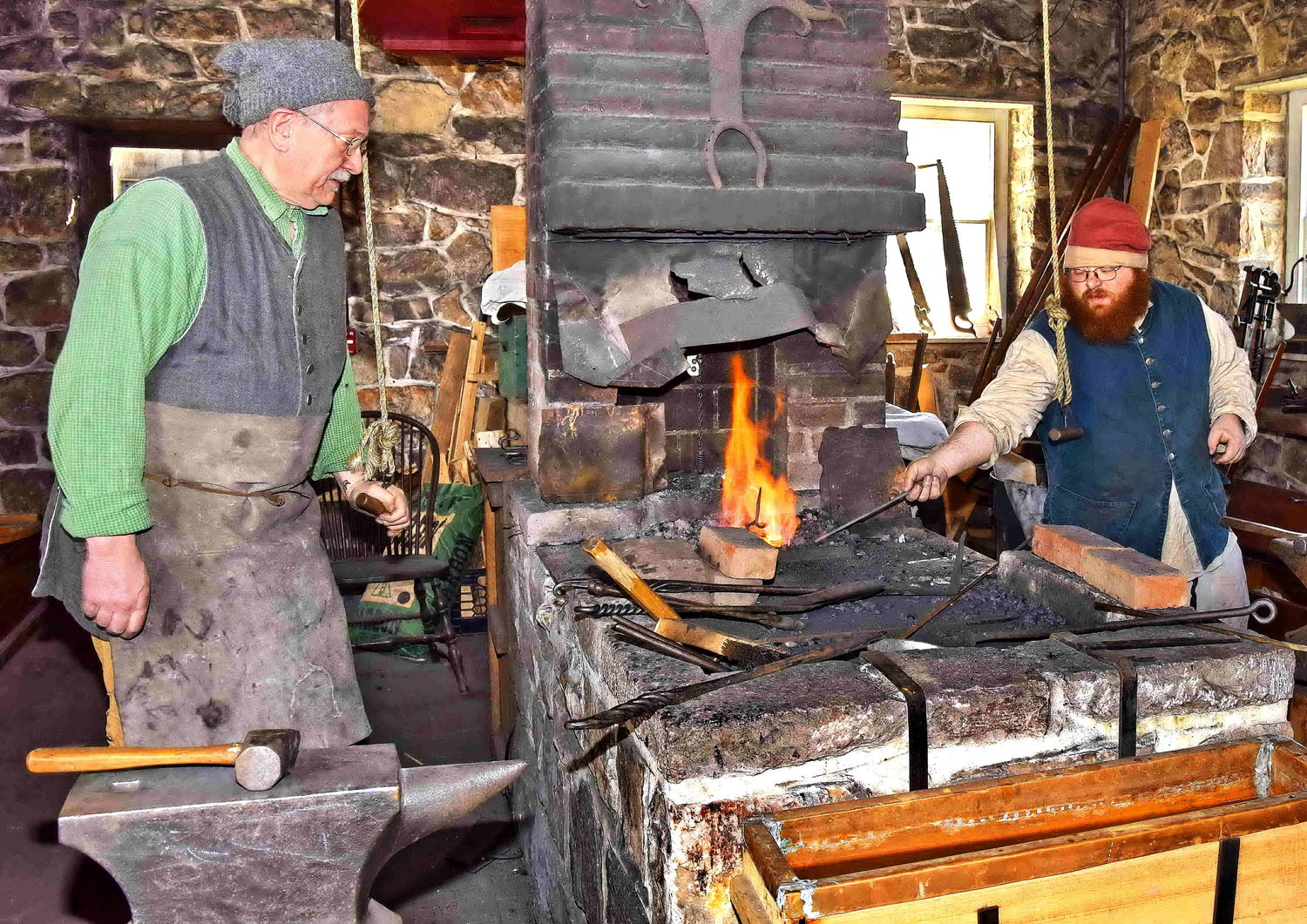 Blacksmiths demonstrate Colonial tool making.