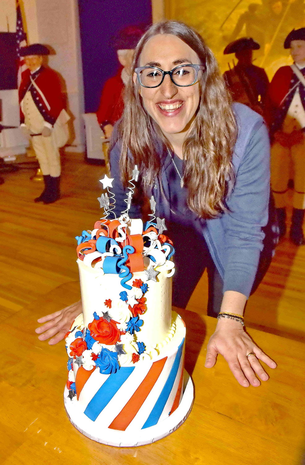 Jennifer Martin, Friends of Washington Crossing Park executive director, stands with George Washington’s birthday cake.