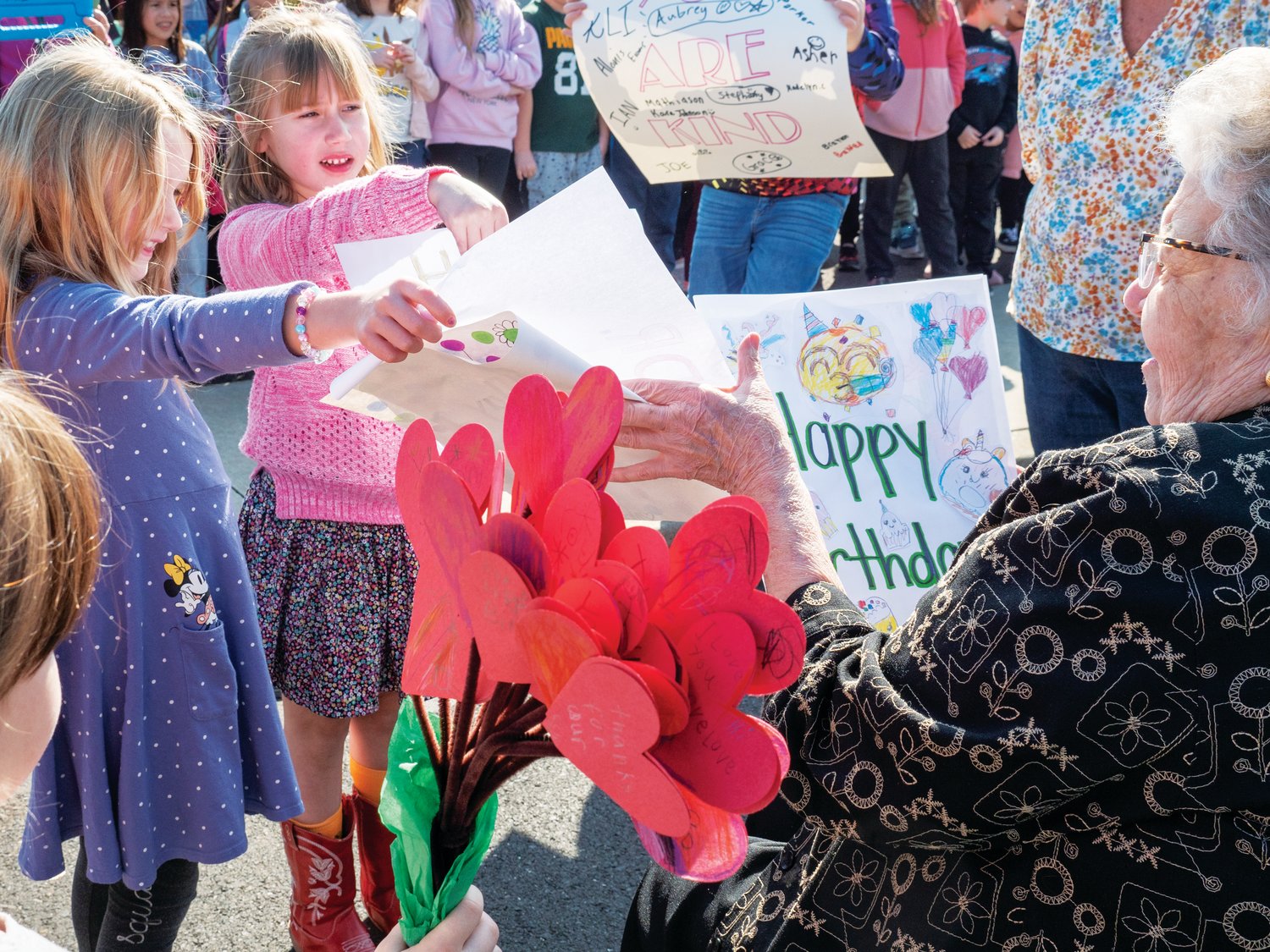 Students at P.A. Guth Elementary School in Perkasie present Dr. Patricia Guth with cards celebrating her 90th birthday. Guth worked in the Pennridge School District for more than 30 years, first as a teacher and eventually as the district’s assistant superintendent for curriculum.