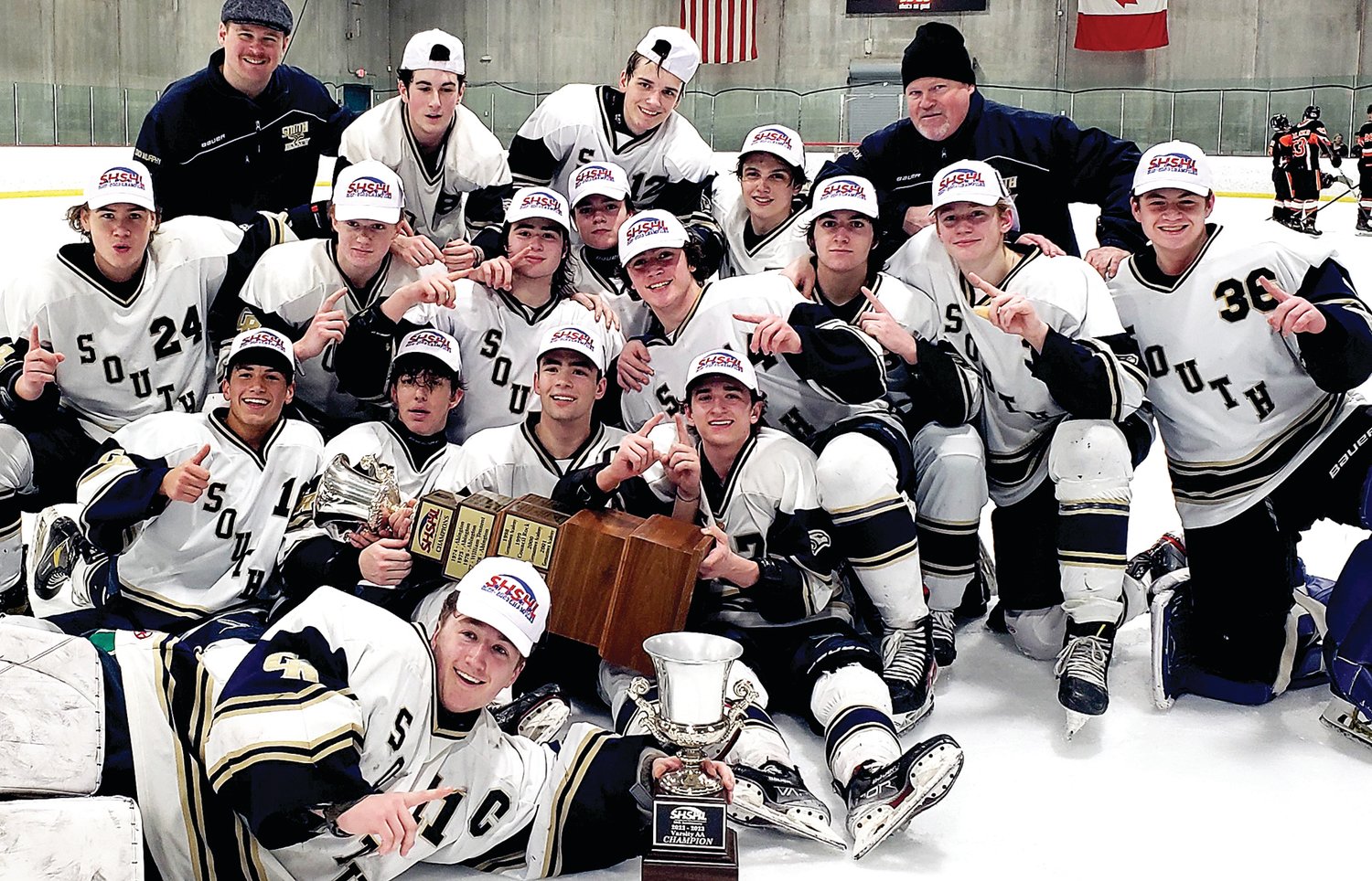 Members of the Council Rock South ice hockey team celebrate winning the Suburban High School Hockey League National Division title.