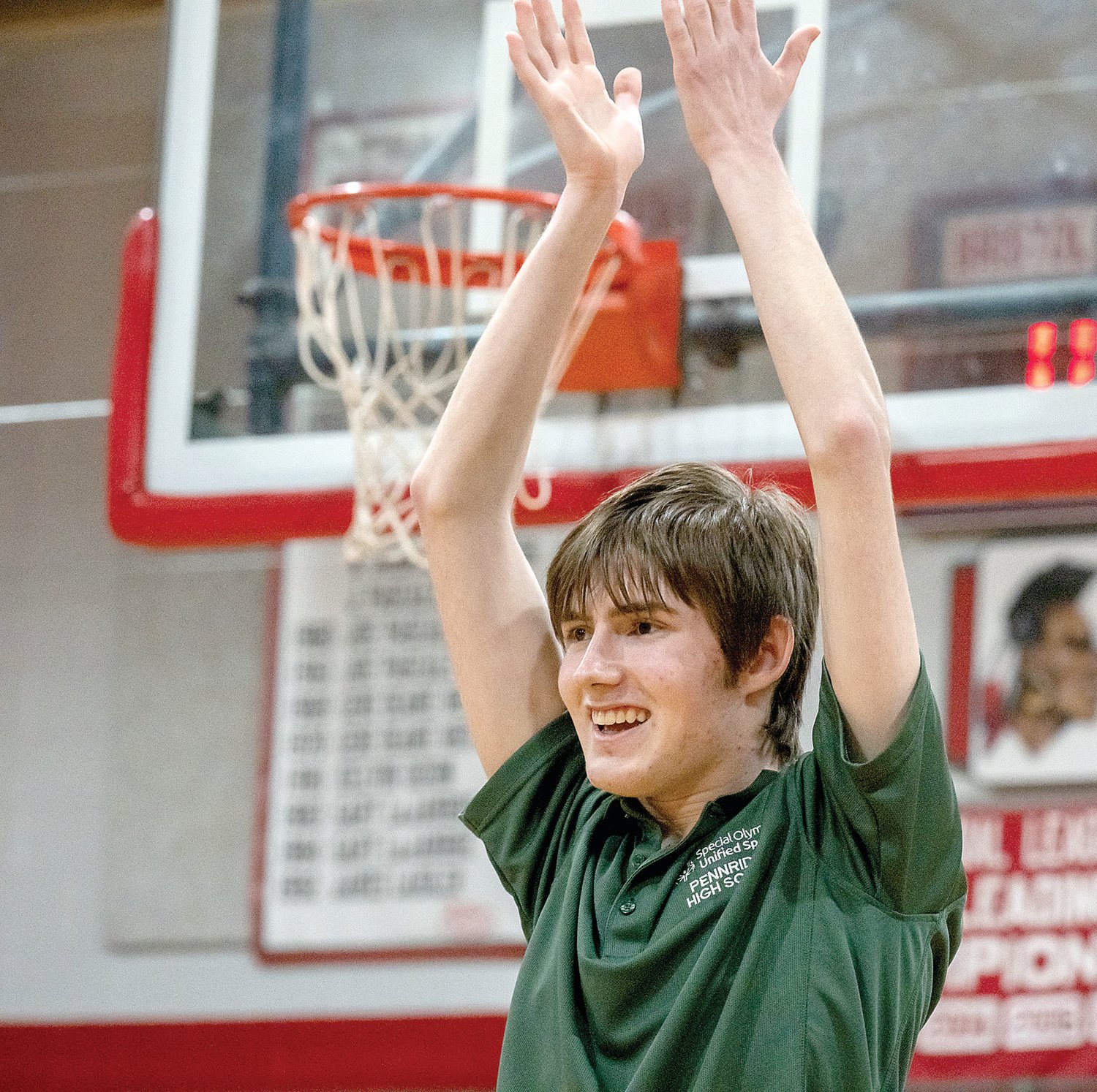 Mason Rolley raises his arms in celebration as Pennridge wins second-place in the Bucks County Unified Bocce Championship, held at Bristol High School March 3.