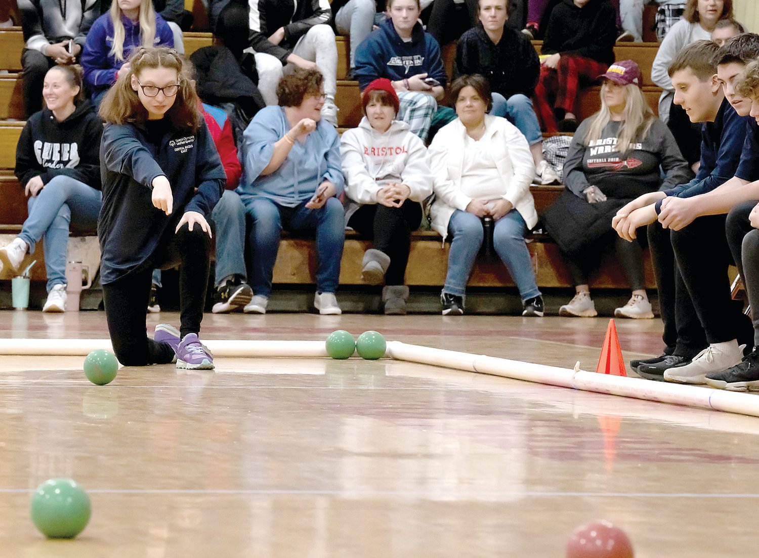 Charlotte Brock rolls the ball down the court during the regional championships March 3. The Central Bucks Unified Sports Bocce Team won first place.