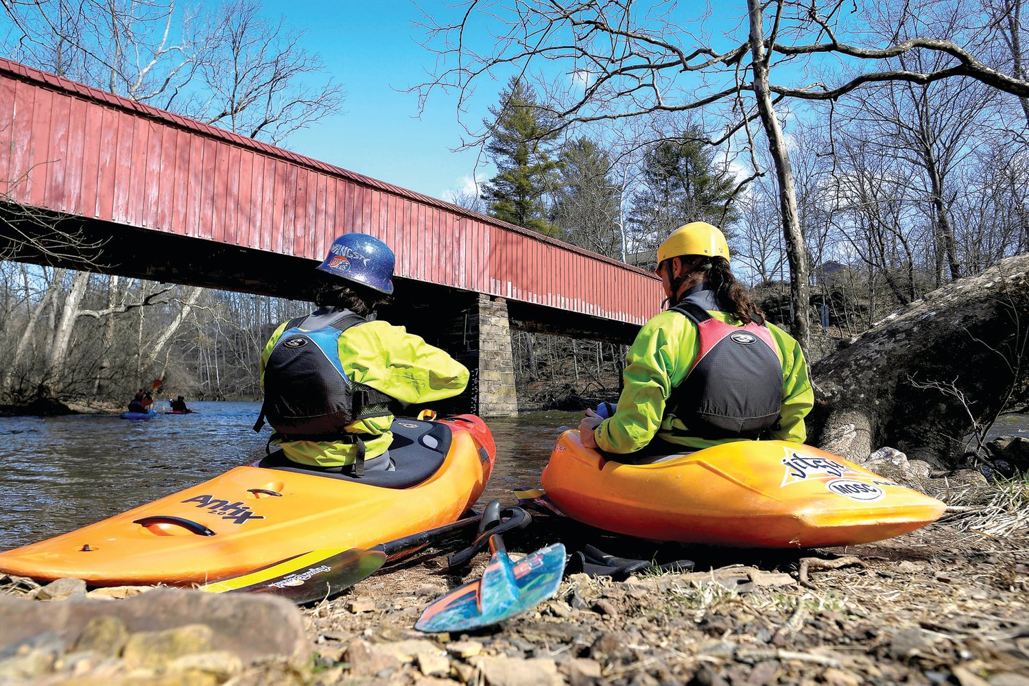 Two kayakers make last minute preparations before launching on March 19.