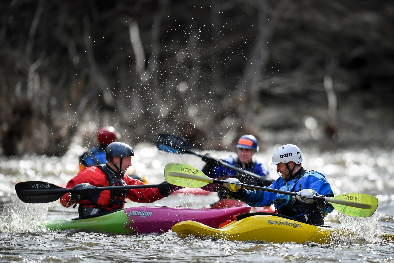 Kayakers make their way downstream.