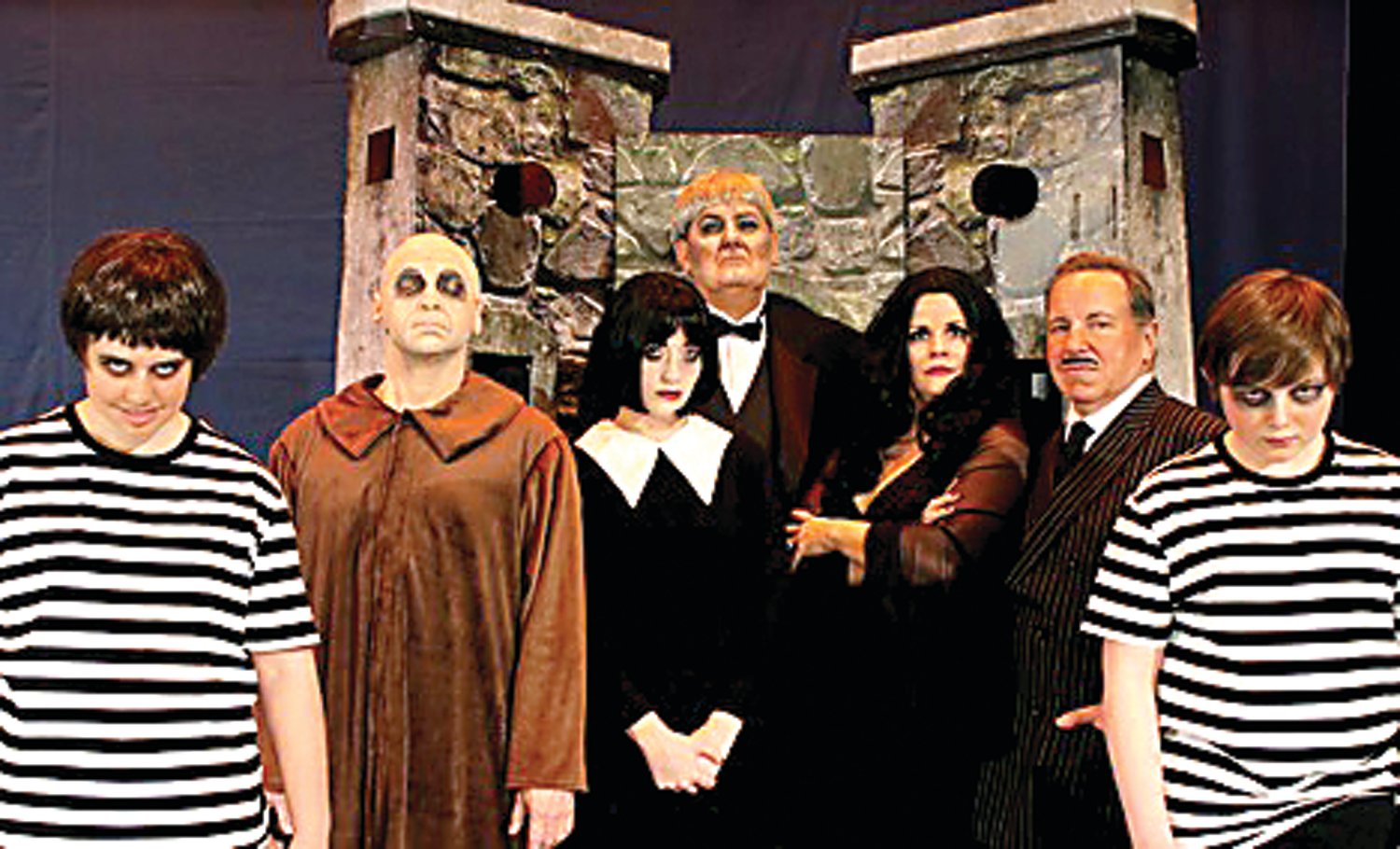 The cast members of Neshaminy Valley Music Theatre’s production of “The Addams Family” are, from left, Lucy Allen of Bensalem as Pugsley, Greg Kopcho of Bensalem as Fester, Marissa Miller of Carversville as Wednesday, Joe Harris of Trevose as Lurch, Courtney Capriotti of Levittown as Morticia, Jack Sariego of Jenkintown as Gomez, and Aiden Barrie of Newtown, also as Pugsley (Barrie and Allen will rotate in the role).